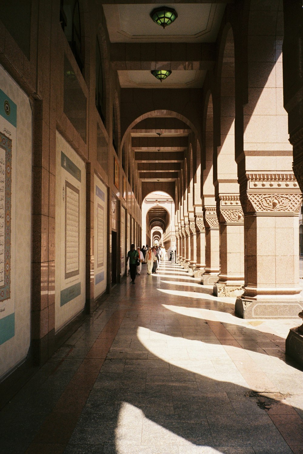 people walking on hallway during daytime