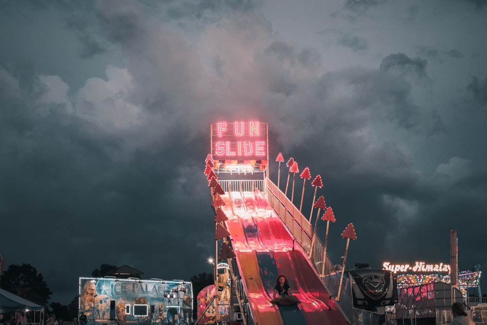 red and white building under gray clouds