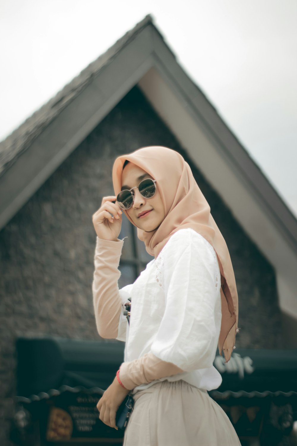 woman in white hijab and white long sleeve shirt
