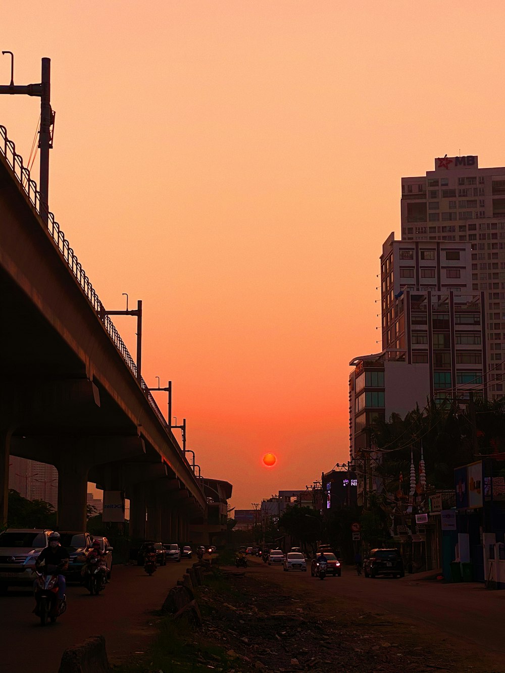 cars parked on side of the road during sunset