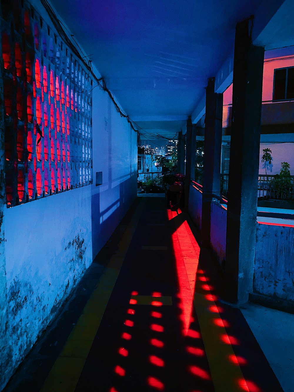 red and white string lights on white concrete building during nighttime