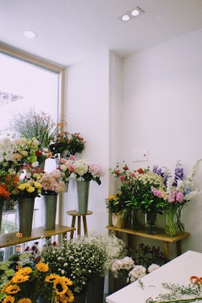 pink and white flowers in vase on table