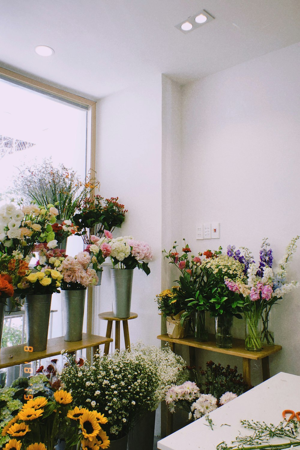 pink and white flowers in vase on table