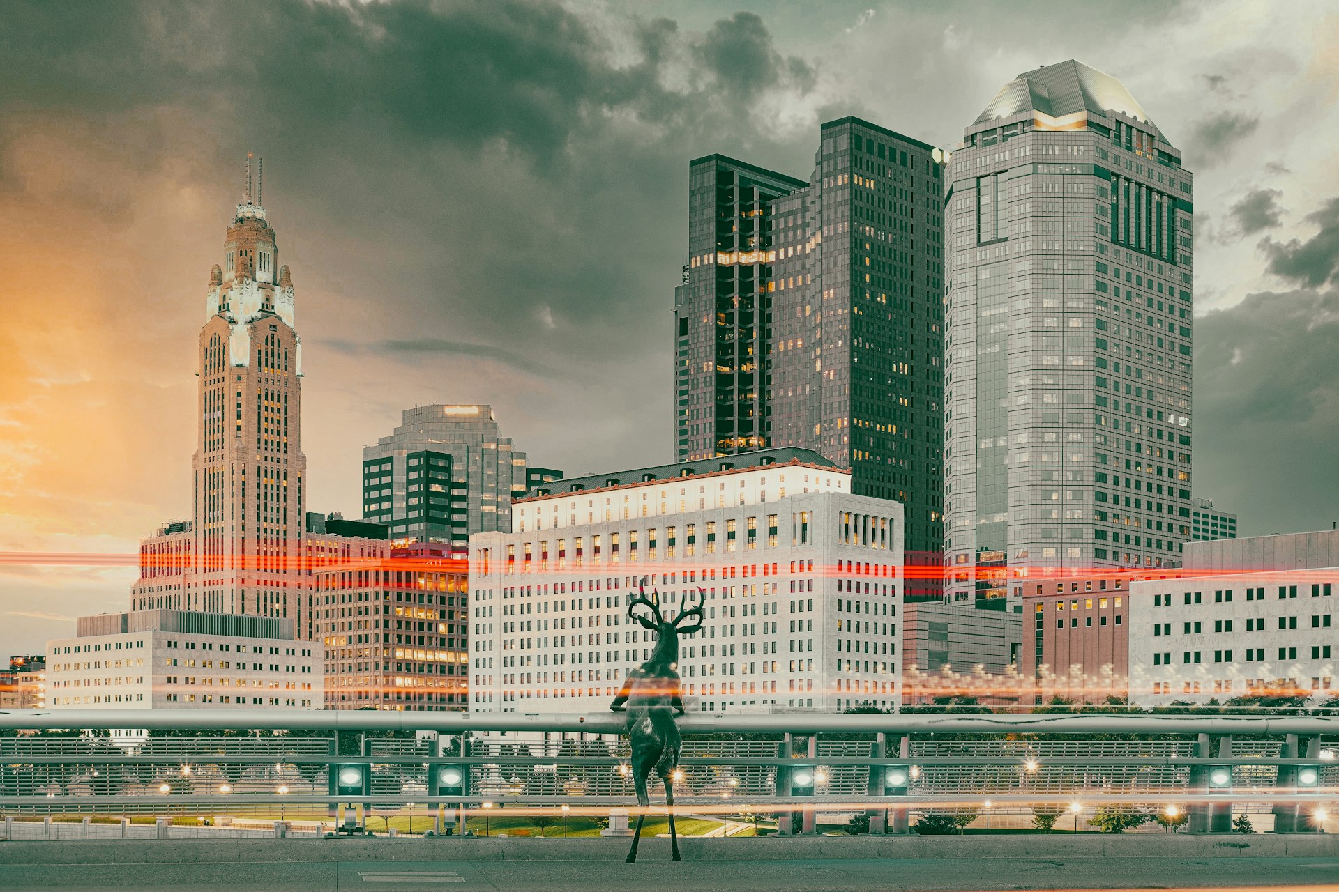 man in black jacket and pants standing on gray concrete pavement near high rise buildings during