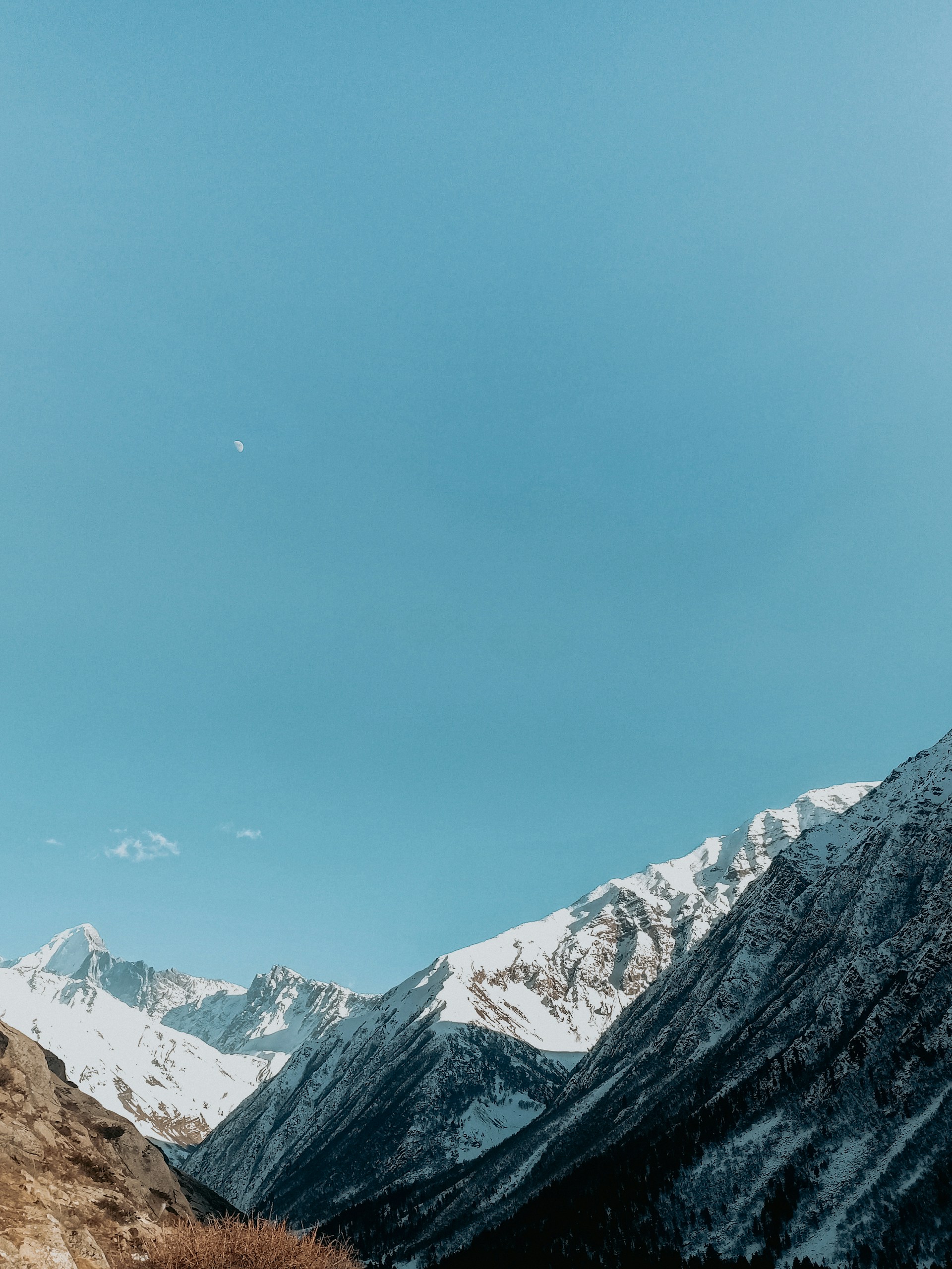 snow covered mountain under blue sky during daytime