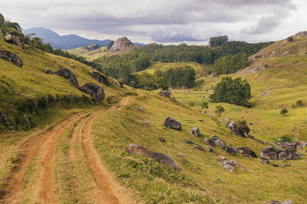 green grass field and mountain during daytime