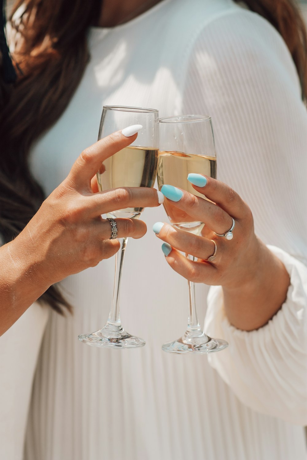 person holding clear wine glass