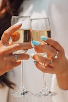 person holding clear drinking glass