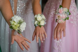 woman in white wedding dress holding white flower bouquet