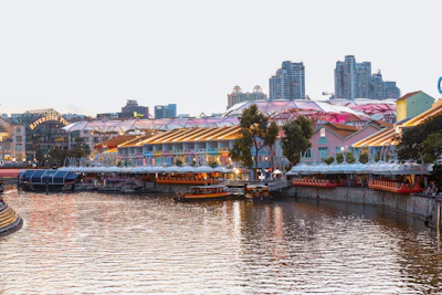 Boats moored along the riverside restaurants of Clarke Quay