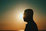 silhouette of man during sunset