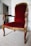 A beautifully restored antique wooden chair with intricate carvings.