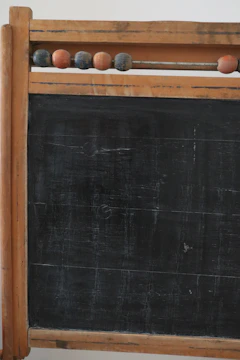 Open encyclopedia page about puzzle history styled with chalkboard aesthetics.