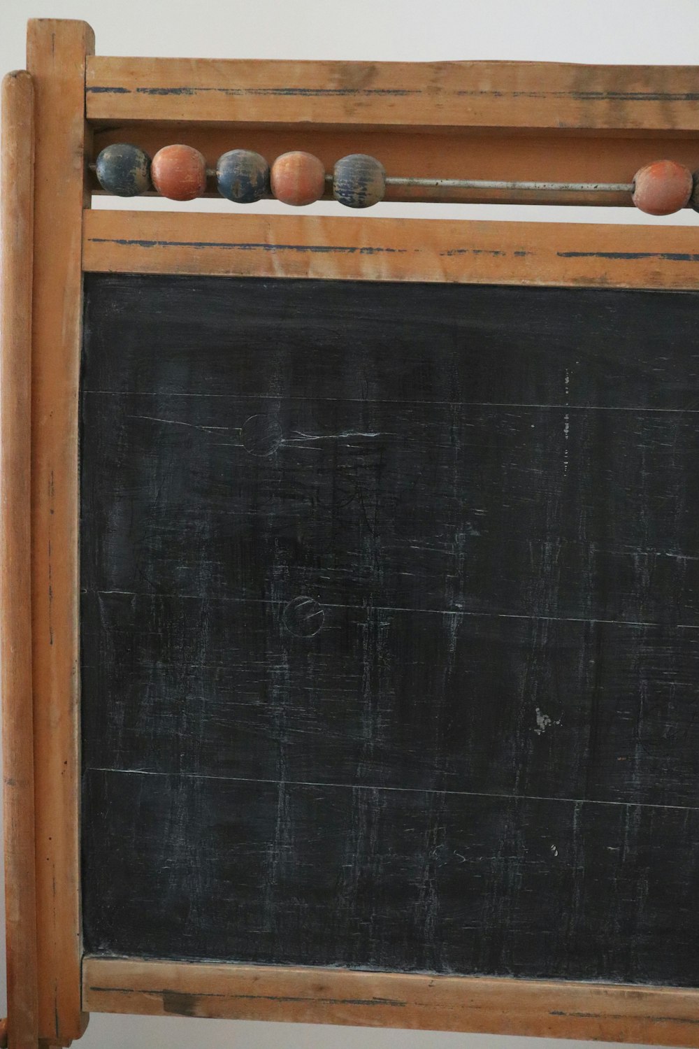 black chalk board on brown wooden rack