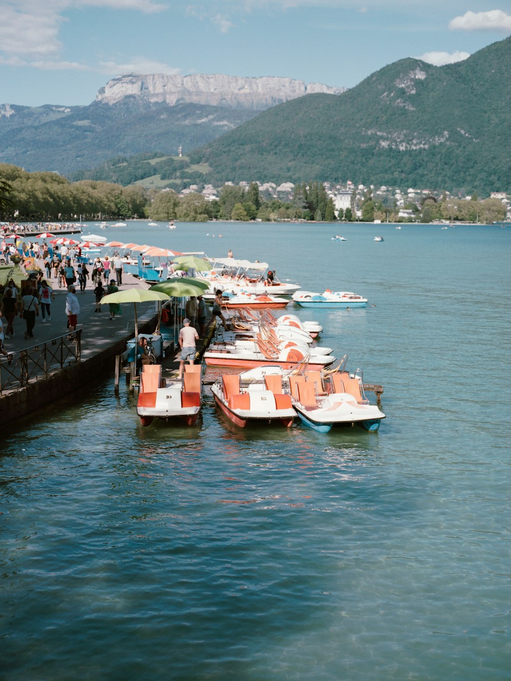 people riding on boat on body of water during daytime