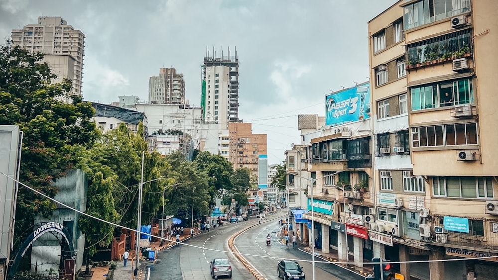 cars on road near buildings during daytime