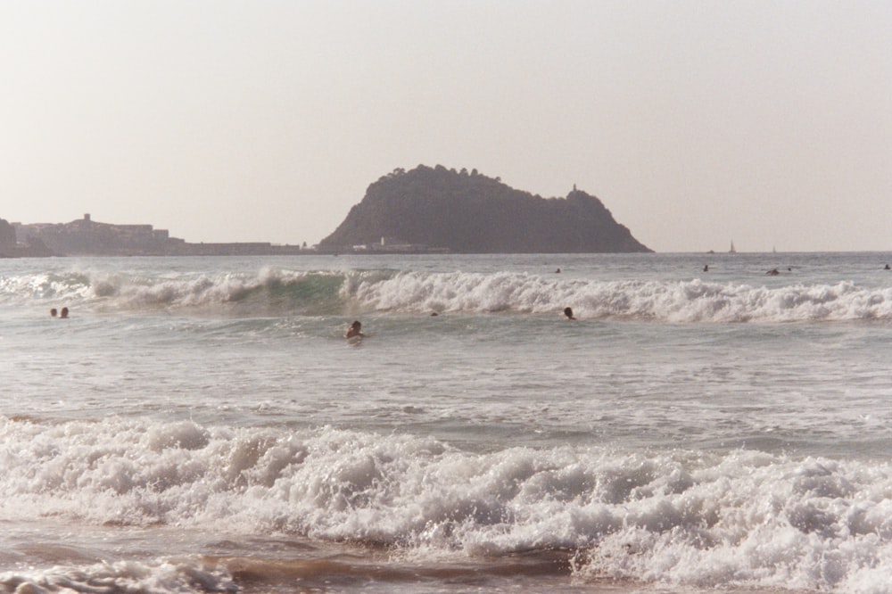 ocean waves crashing on shore during daytime