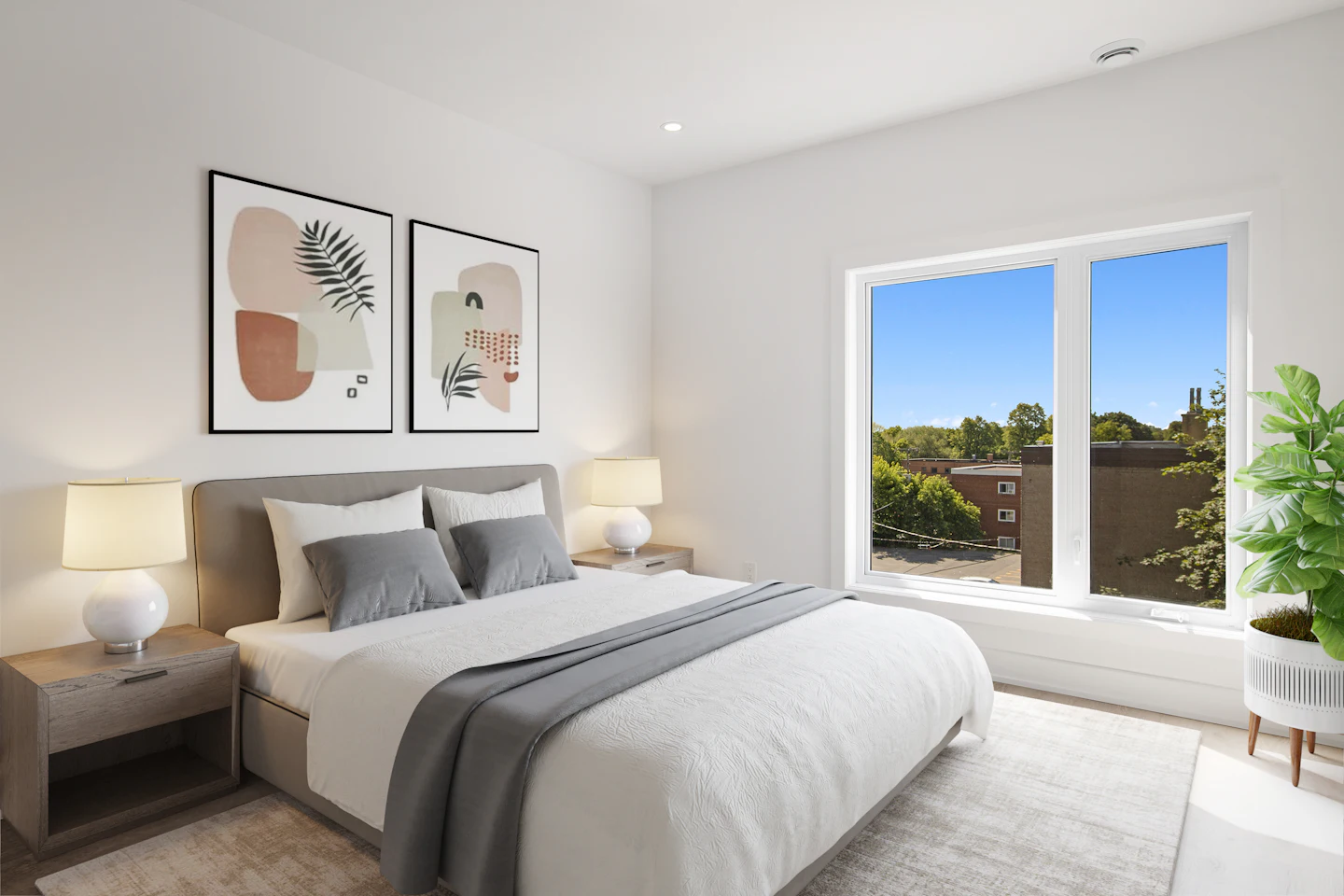 Calm primary bedroom with white linens and a large window