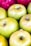 Several apples are tightly packed together, showcasing a mixture of green and red hues. The apples appear fresh and have a glossy texture, indicating their ripeness.