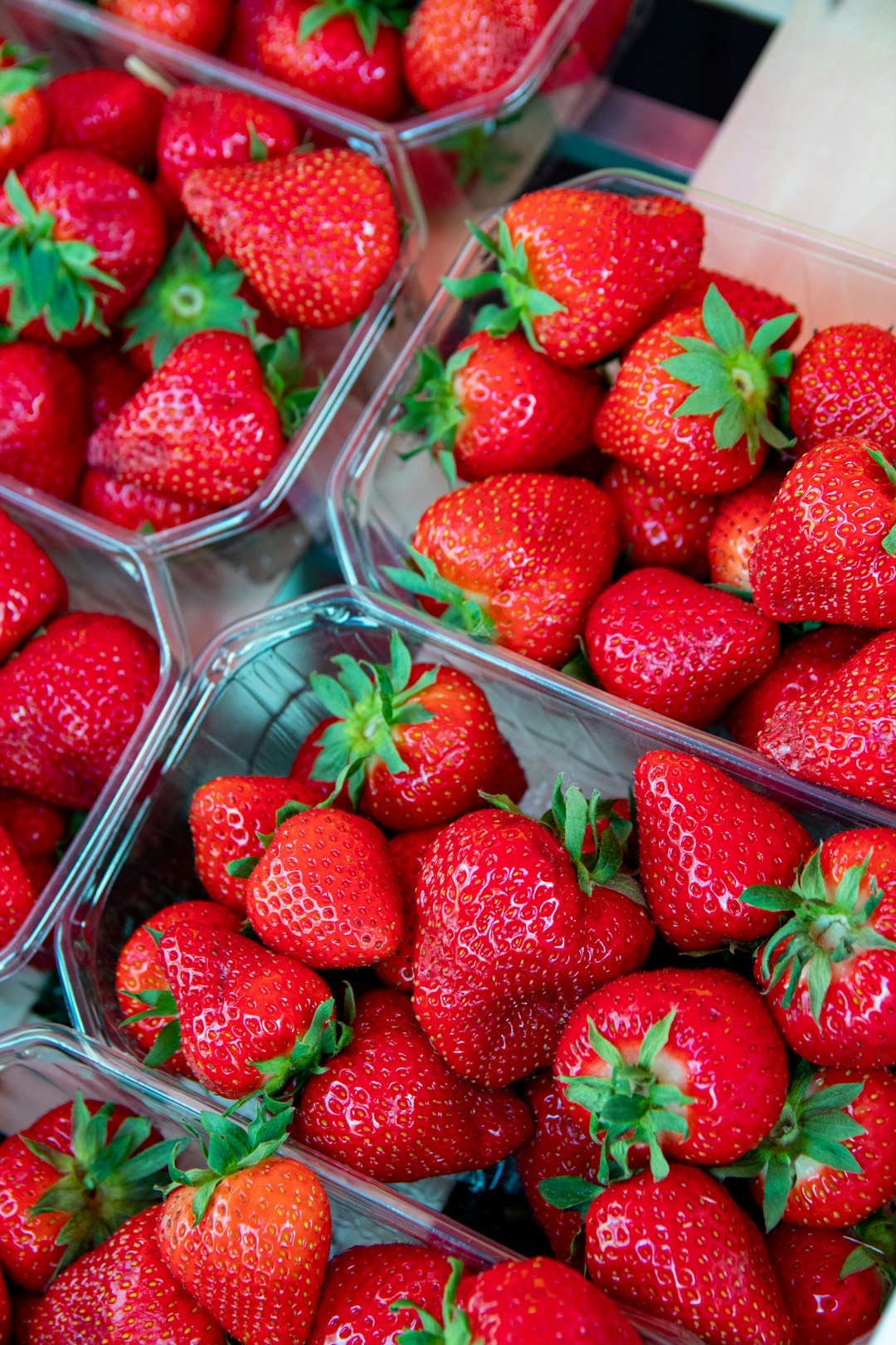 red strawberries in plastic container