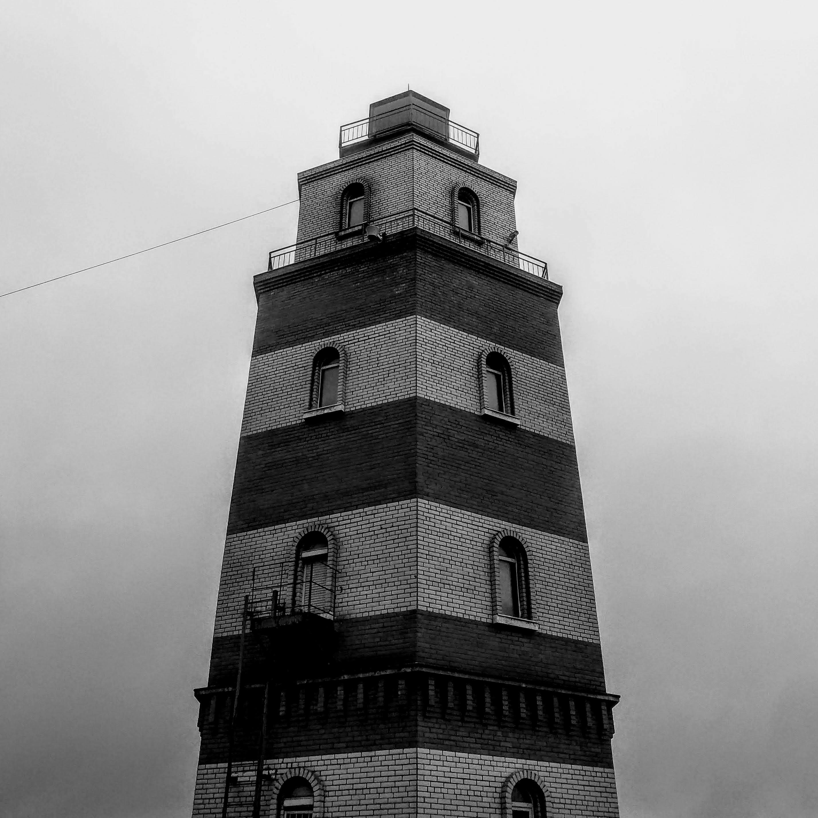 Brown concrete tower under white sky photo Free Russia Image on Unsplash