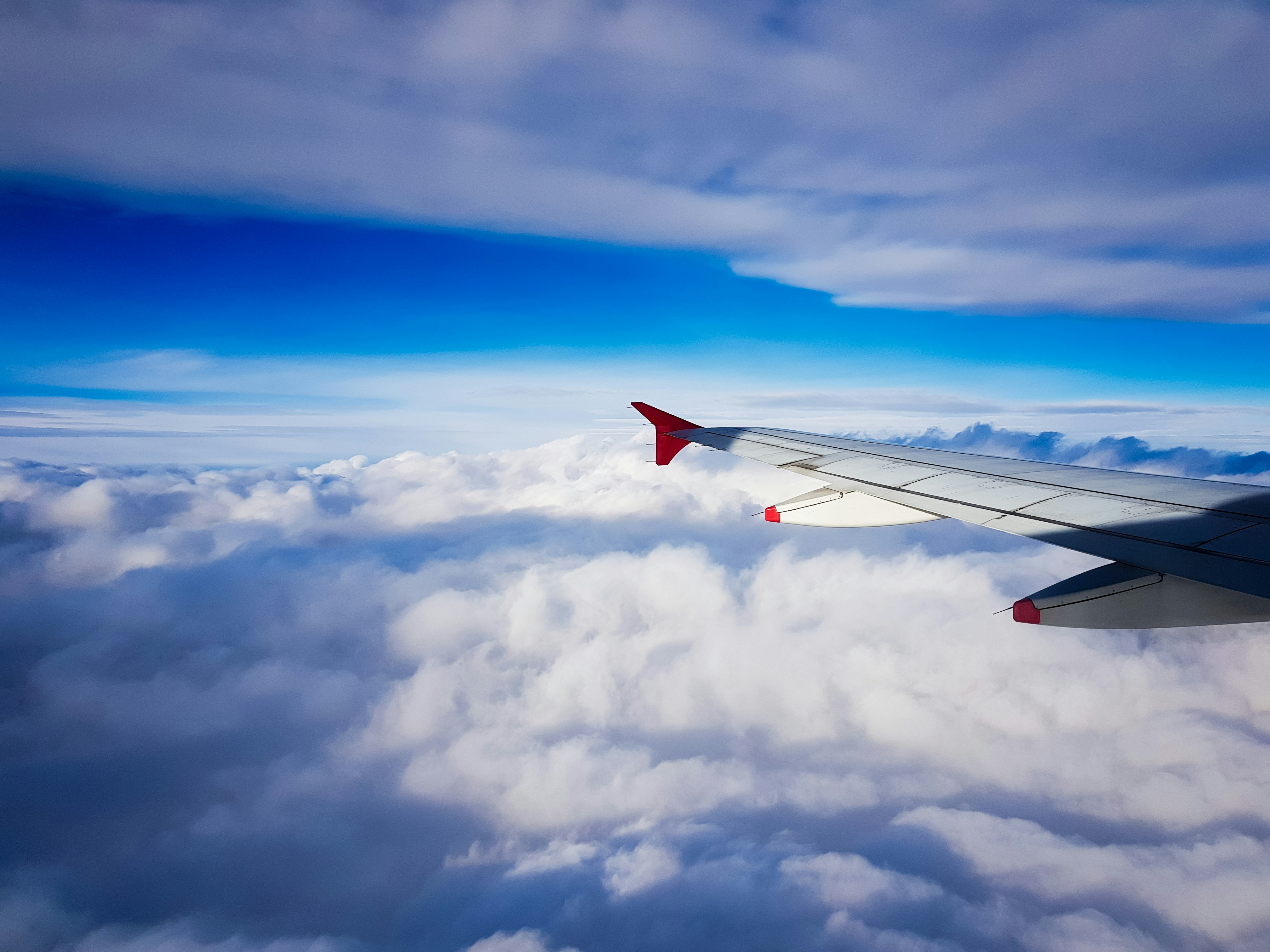 3 Simple Ways to Reduce Jet Lag Before You Even Land – white clouds and blue sky during daytime