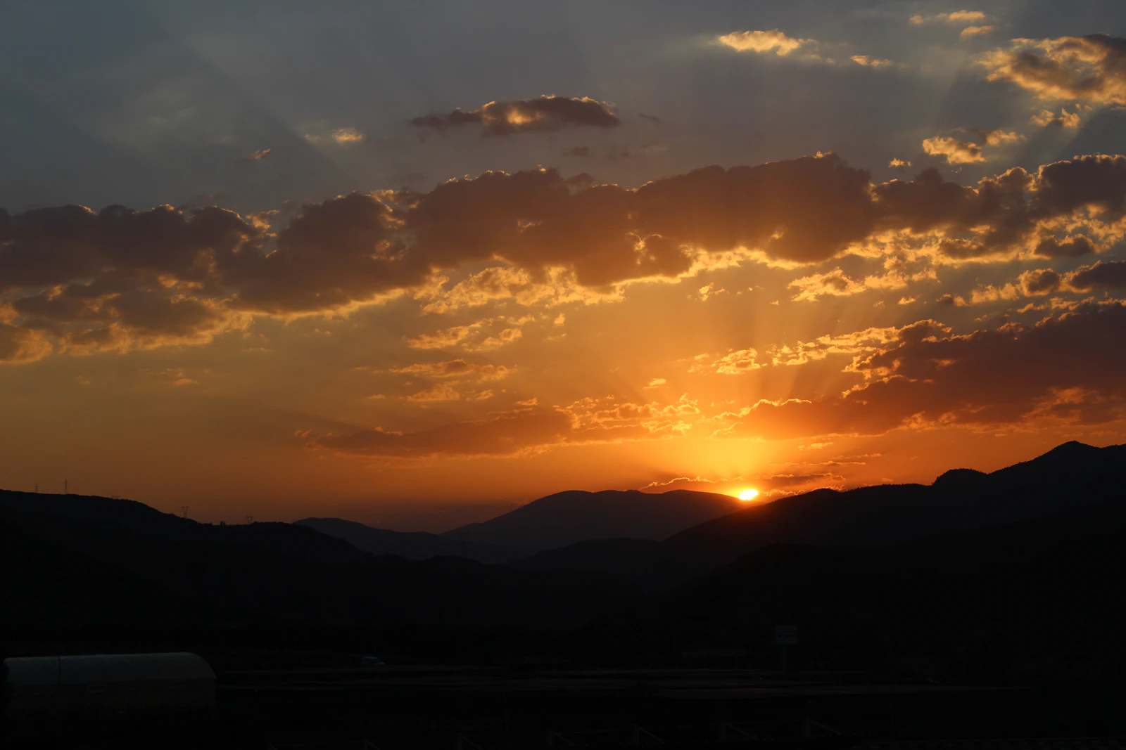 silhouette of mountain during sunset