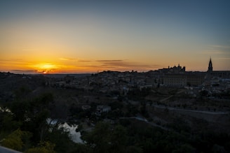 A picturesque sunset over a historic city skyline, highlighting its architectural beauty.