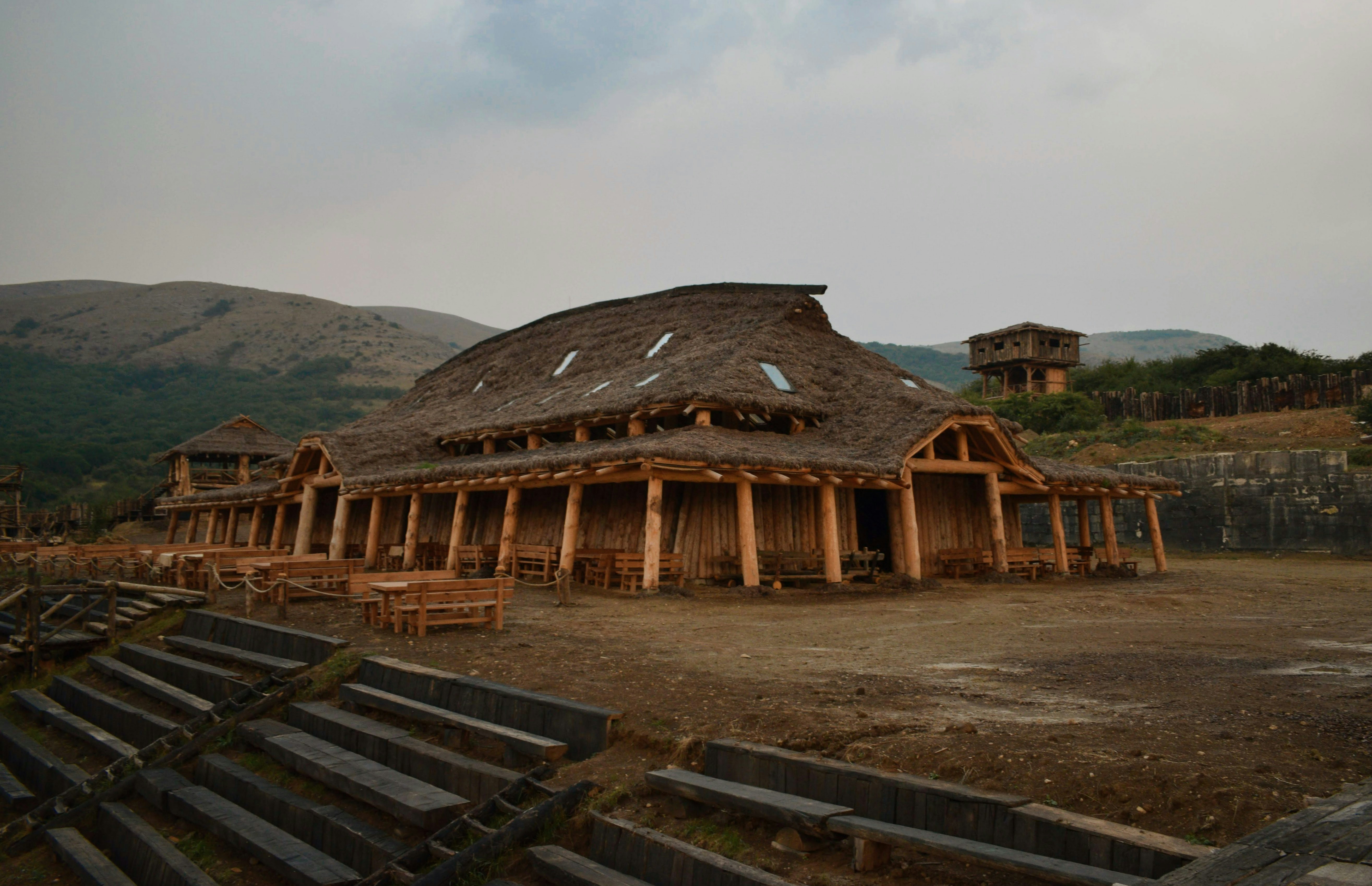 brown wooden house near mountain during daytime