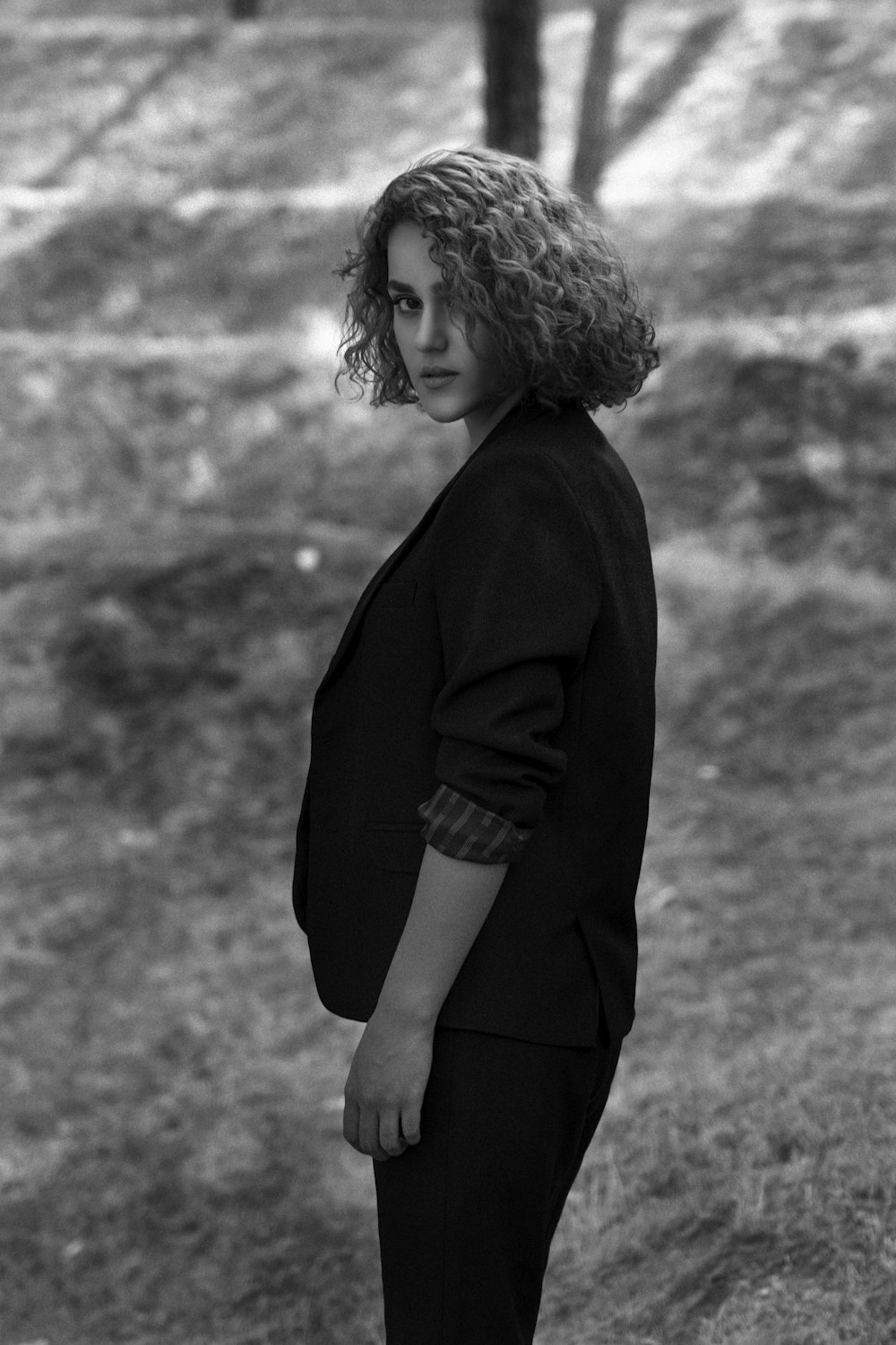 grayscale photo of woman in black long sleeve dress