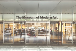 a museum of modern art with people walking in it