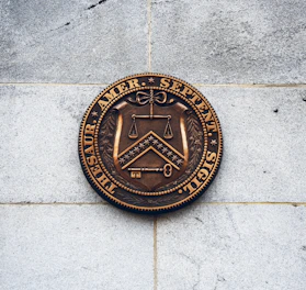 Icon representing law and security with a shield and scales.