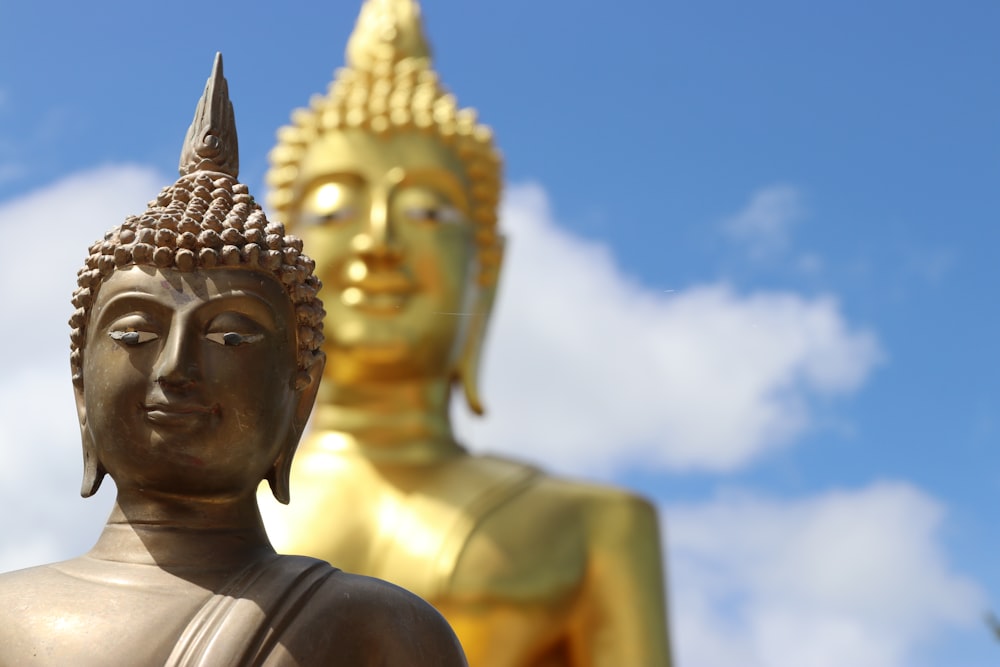 gold buddha statue during daytime