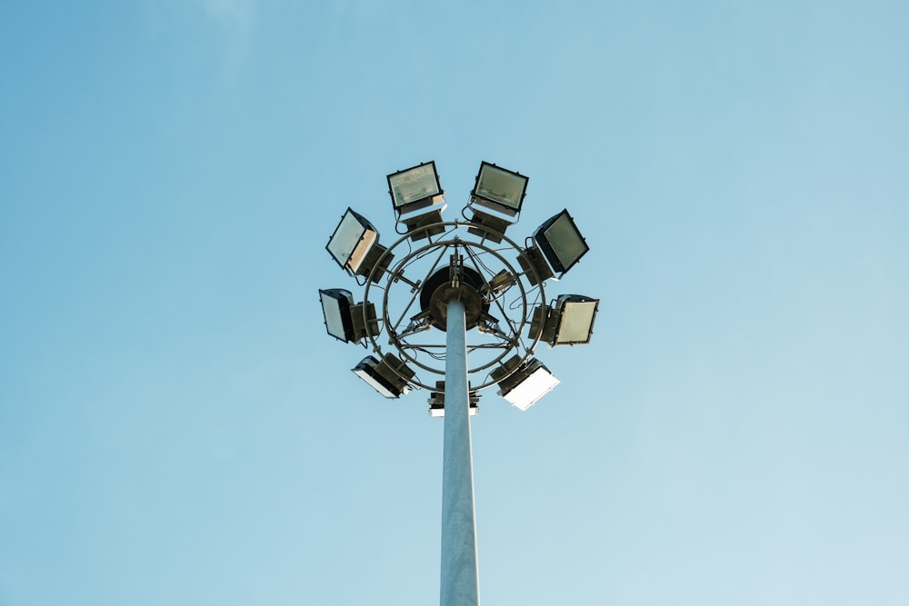 gray and white street light under blue sky during daytime