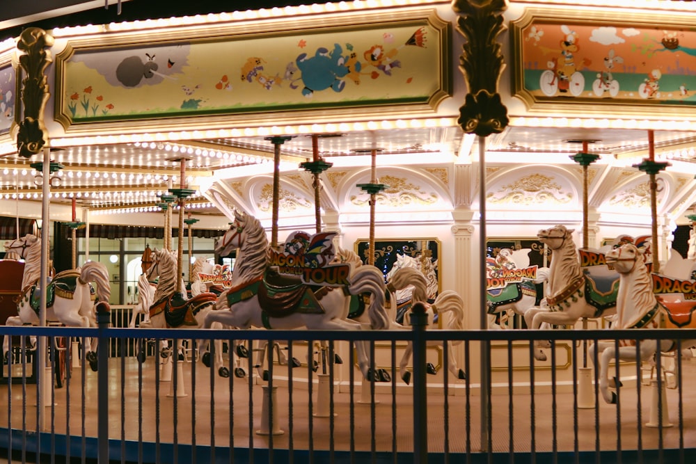 people riding on carousel during daytime