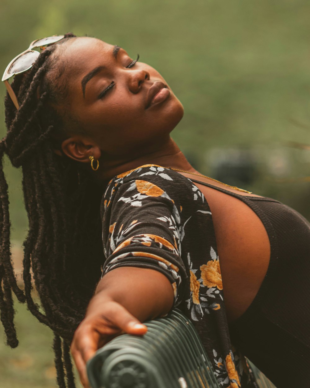 woman in black and yellow floral shirt