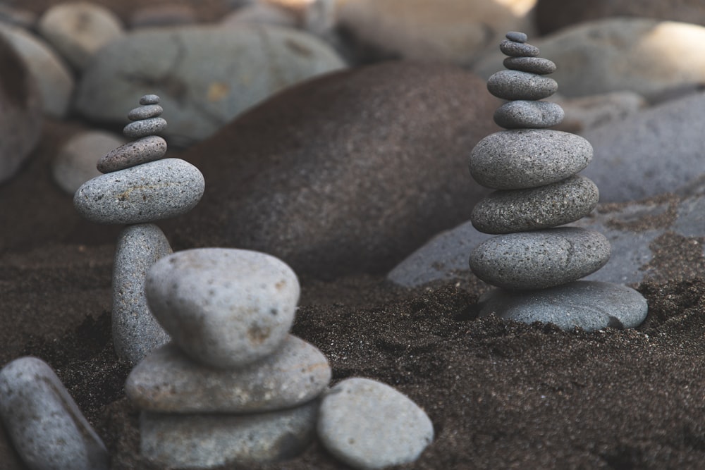 gray stone stack on brown soil