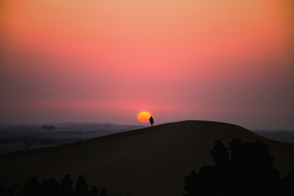 silhouette of mountain during sunset