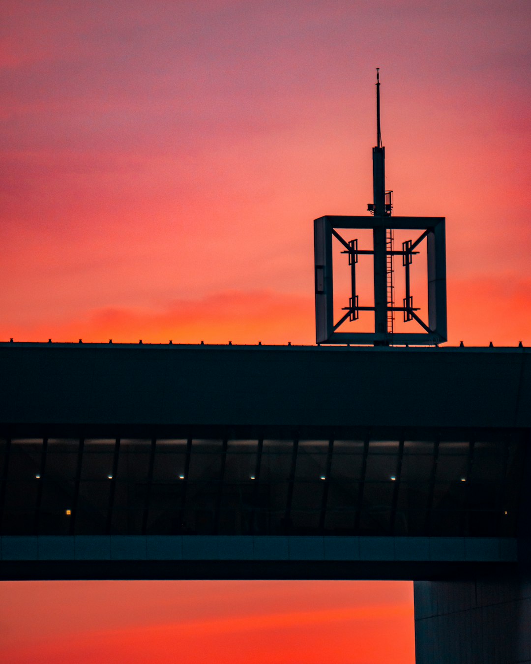 black and white tower under orange sky