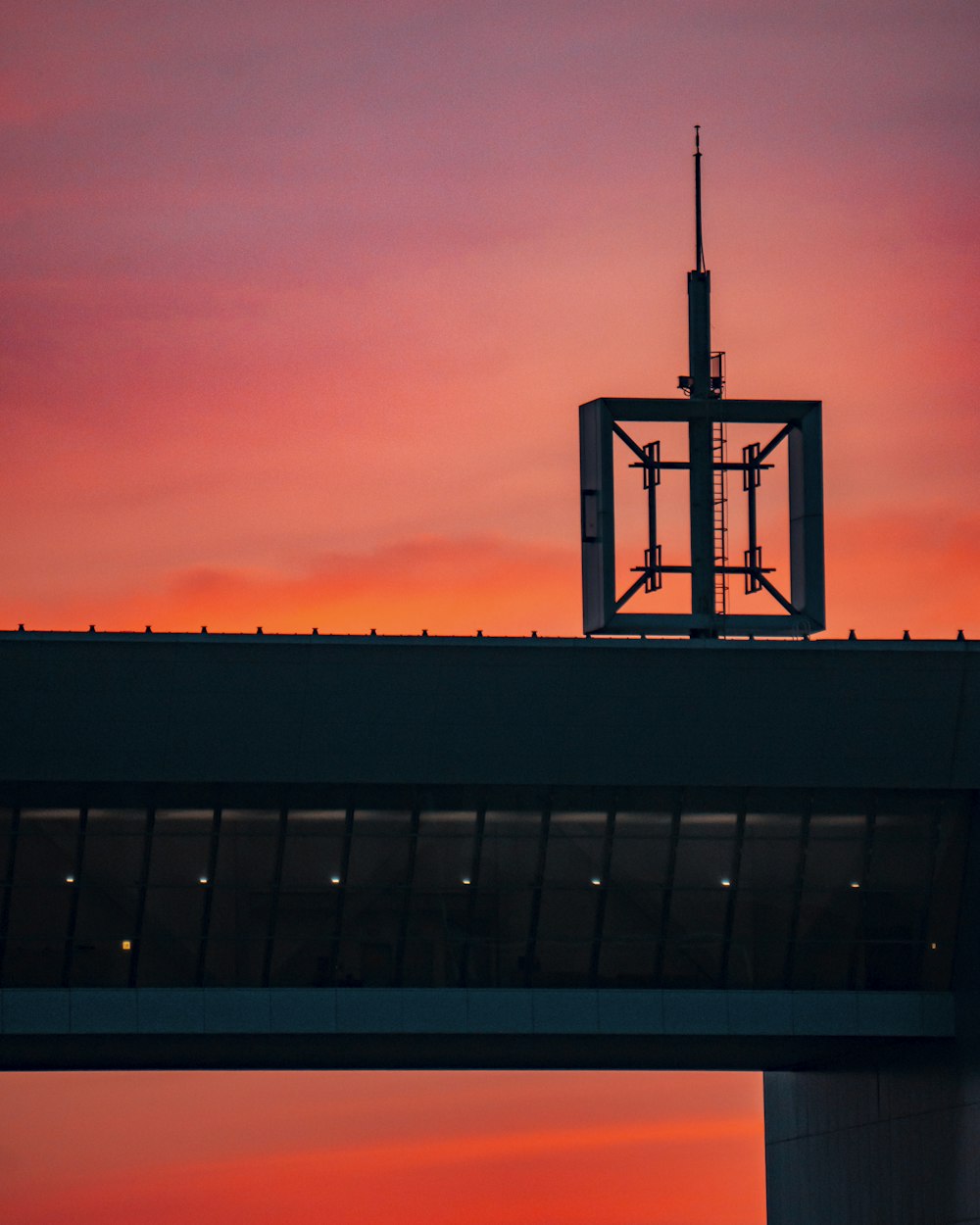 black and white tower under orange sky