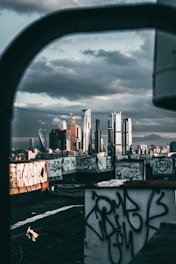 city skyline under cloudy sky during daytime