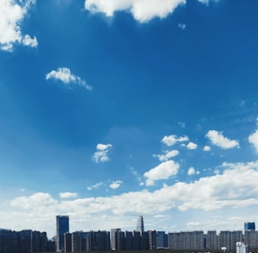 A cityscape showing government buildings under a clear sky.