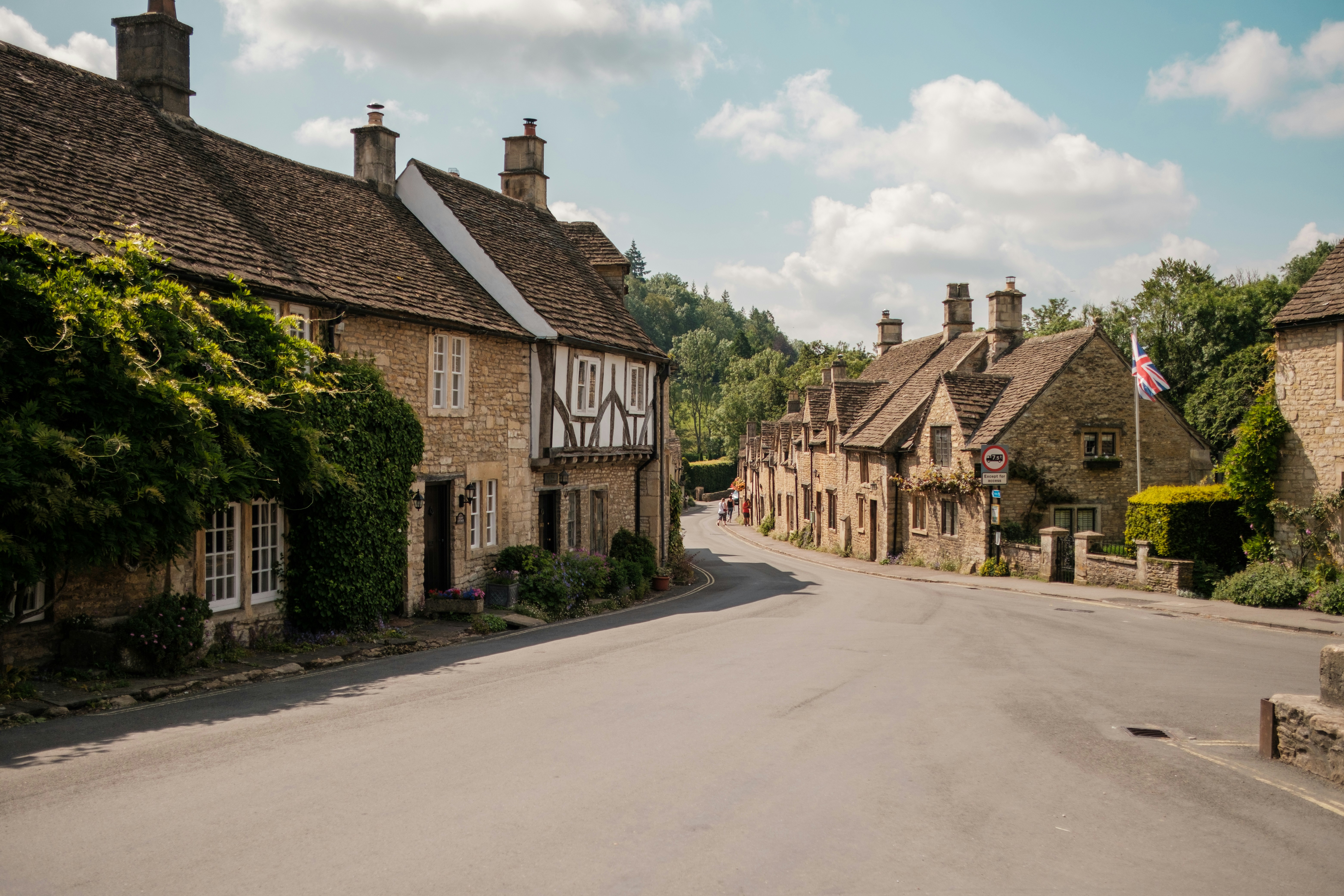 brown brick building near green trees during daytime, Castle Combe