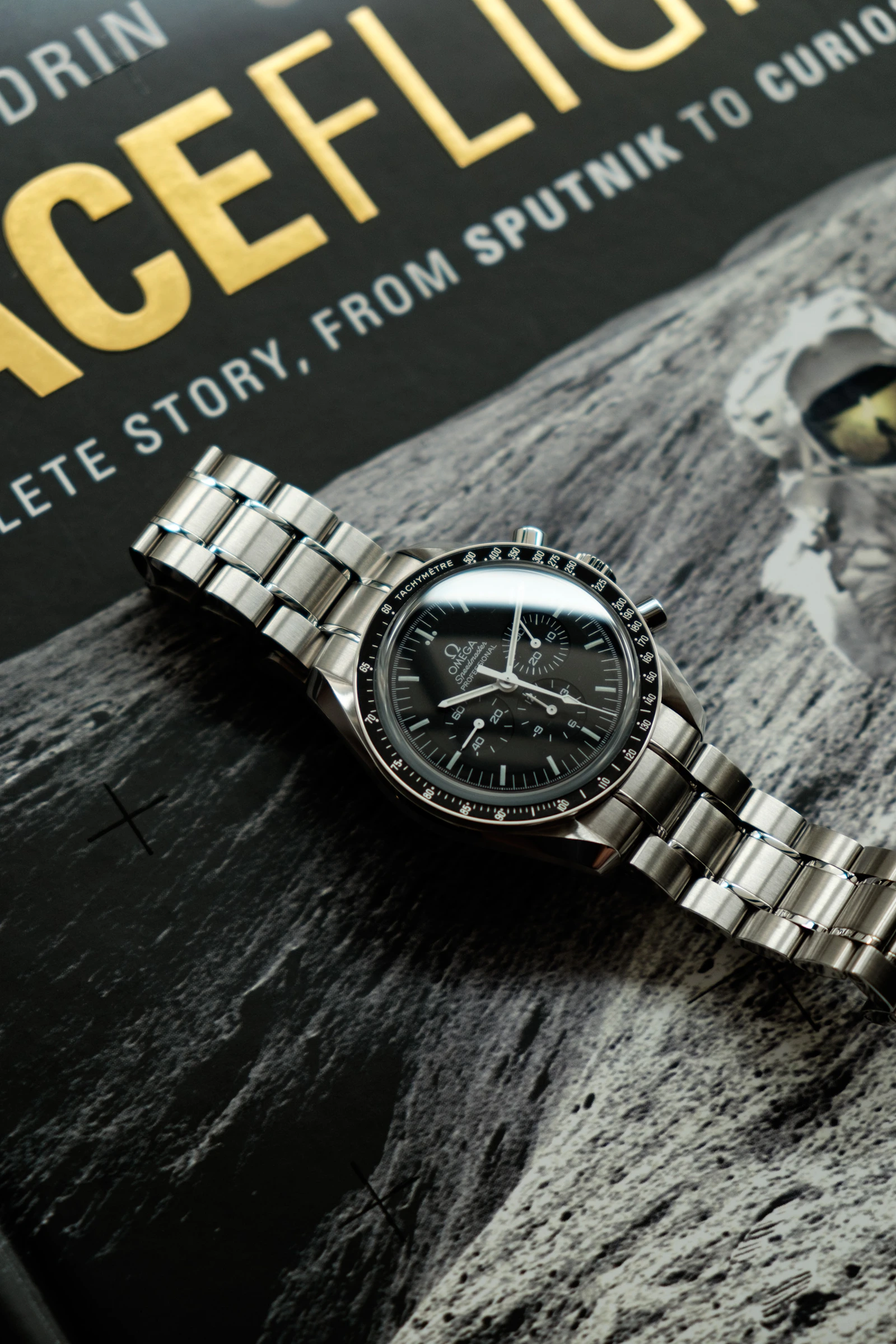 Omega Speedmaster on a spaceflight book