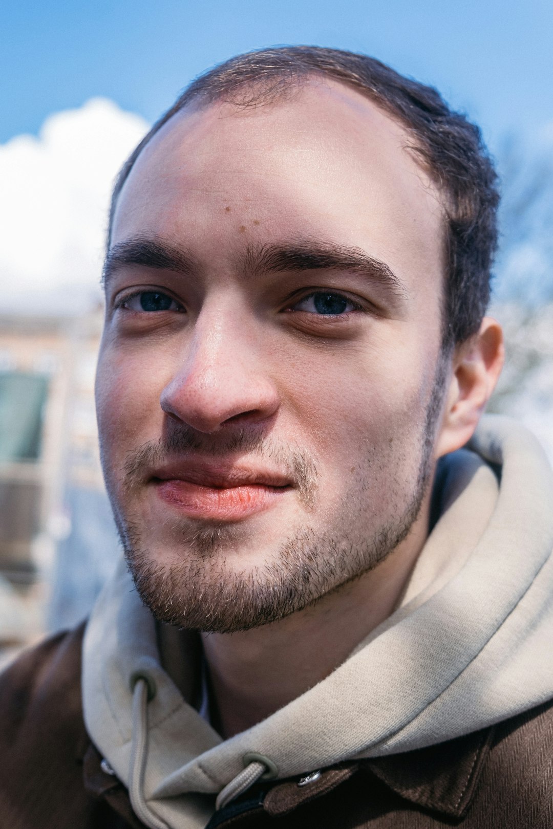 man in beige collared shirt