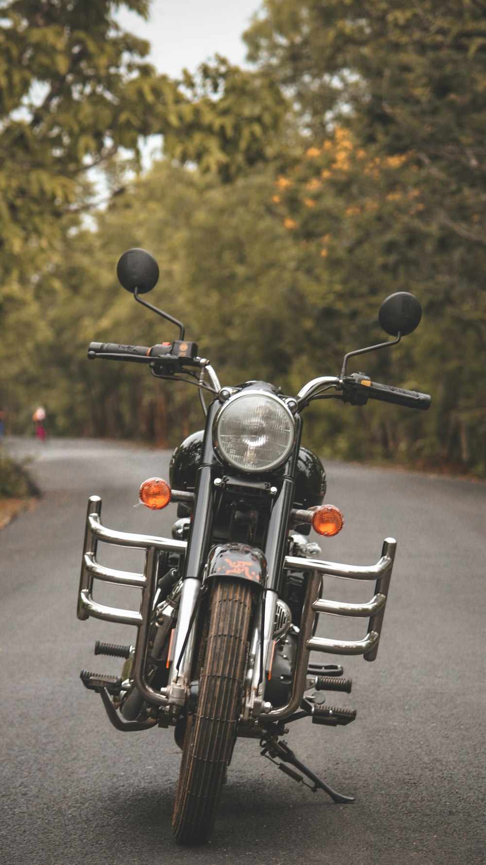 black motorcycle on gray asphalt road during daytime