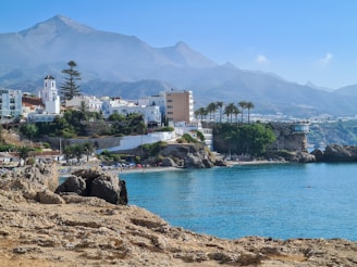 white concrete building near body of water during daytime