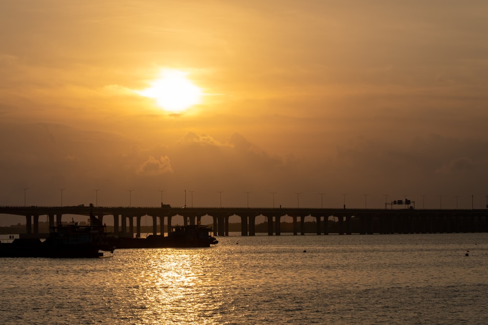 silhouette of bridge during sunset