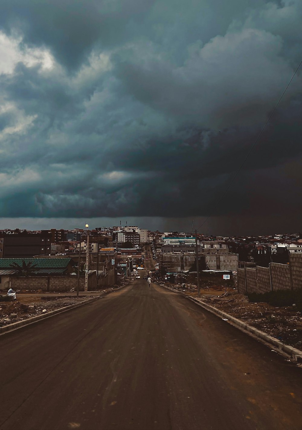 city buildings under gray clouds