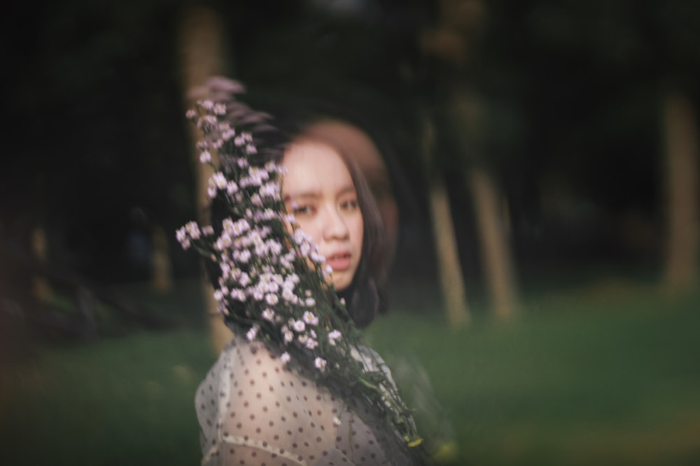 woman in white and black polka dot shirt